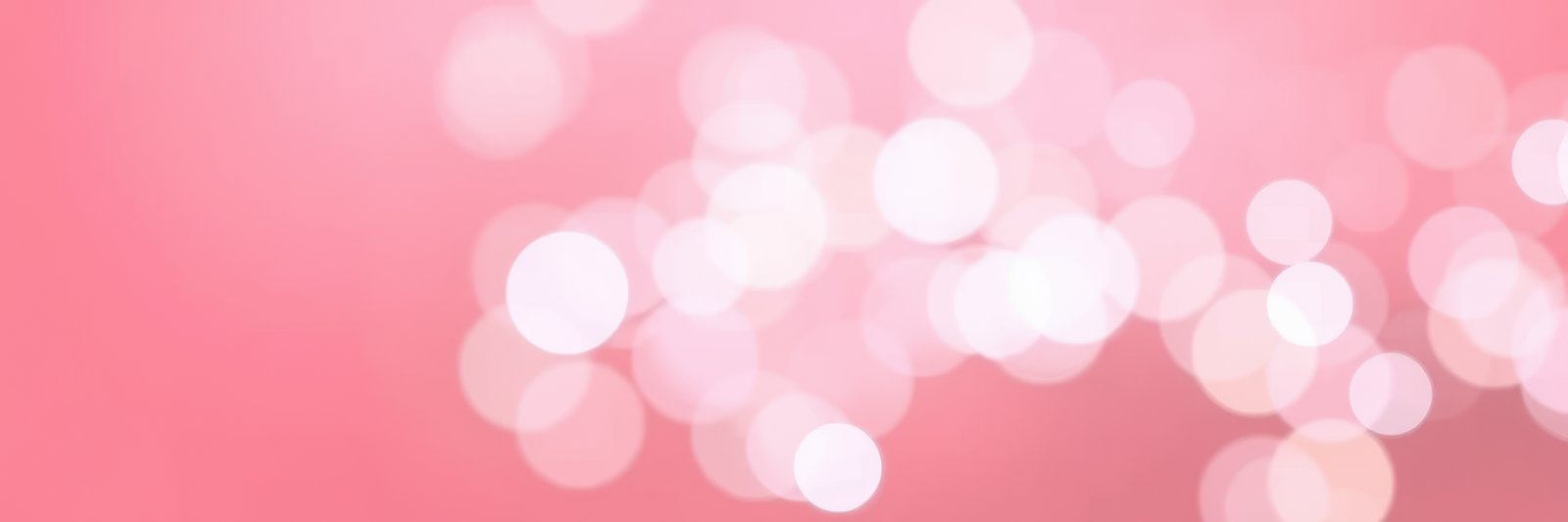 Soft pink bokeh background creates a warm and inviting atmosphere for celebrations and special occasions